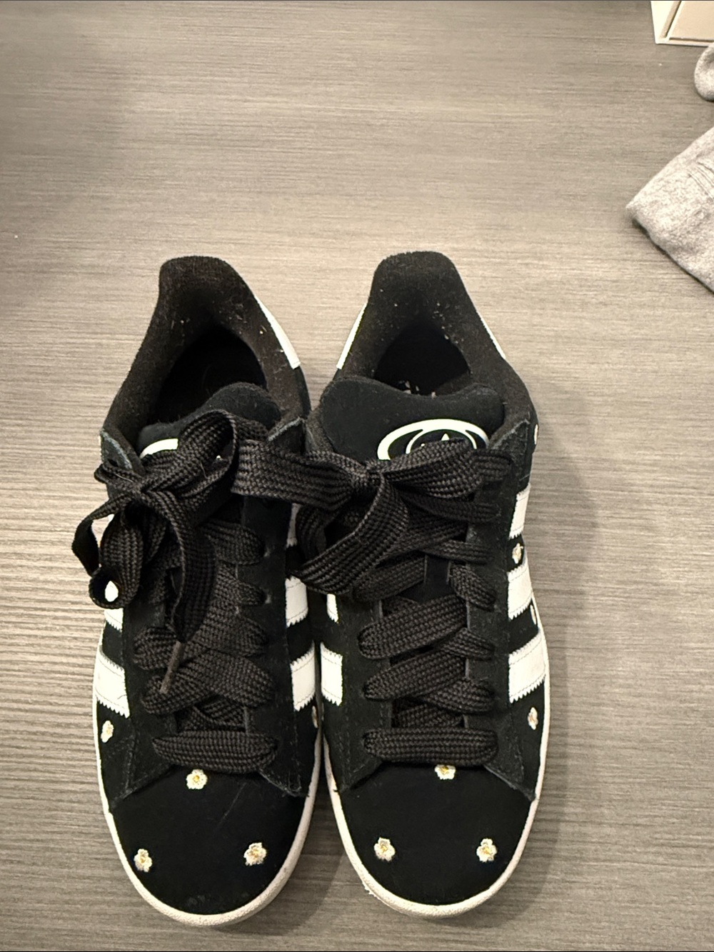 adidas Women’s Black Sneakers with White Stripes and Daisy Accents